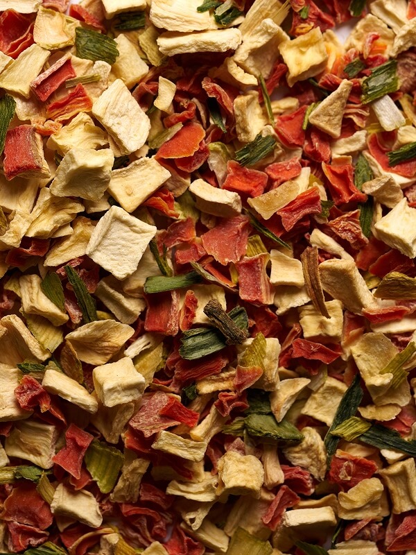Dehydrated carrot, potato, and parsley flakes in a bulk vegetable blend